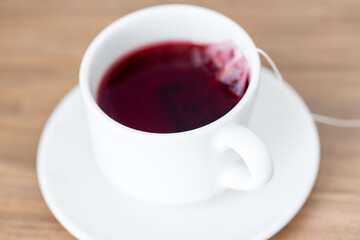 A Cozy Cup: Red Tea in a White Mug – A Simple Restaurant Delight