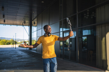 Excited influencer creating content with smart phone gimbal