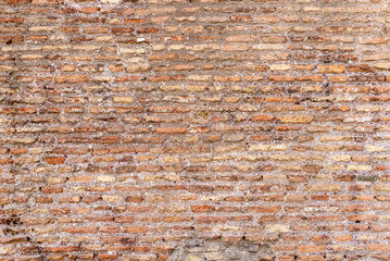 Close-up of rustic brick wall texture, weathered and aged for authentic historical detail
