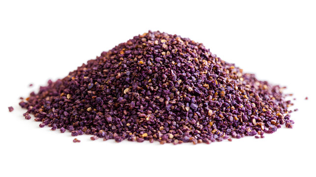 Sumac powder arranged in aneat pile, its purple colo contrasted beautifully aginst the white surface, pefect for a food still life