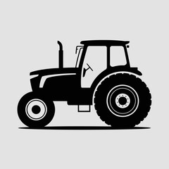 Obraz premium Silhouette of a modern agricultural tractor with large rear wheels