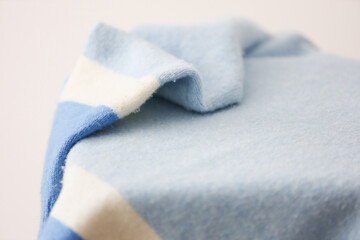 Soft light blue and white blanket with gentle folds