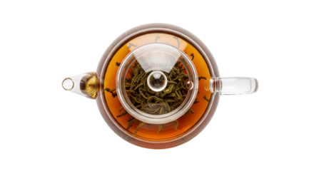 Top view of a glass teapot with an infuser and amber tea, isolated on white and transparent background for beverage and herbal concepts