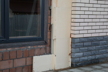 House insulation. Rigid insulation installed in the lower part of the house.