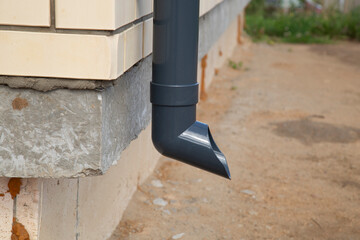 Modern guttering on a modern roof. Roof drainage.
