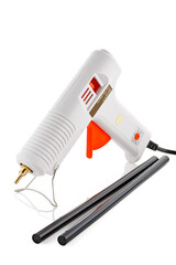 Electric hot glue gun with glue sticks . Hot glue gun isolated on white background.
