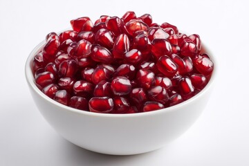 Fresh pomegranate seeds in a white bowl ready for cooking or snacking with vibrant color and healthy benefits showcased