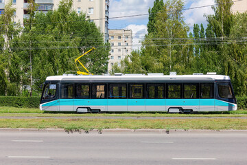 Obraz premium Modern Tram in Urban Environment