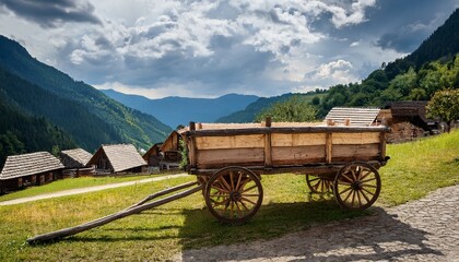 Fototapeta premium handmade wooden cart near mountain village homes high resolution picture