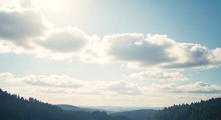 Vast Sky with Fluffy Clouds Over Rolling Hills.