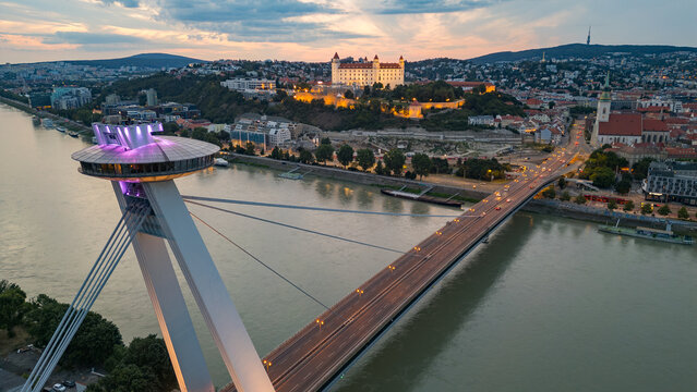 Sunset view of SNP bridge and panorama of Bratislava, Slovakia