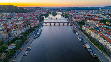 Obraz premium Sunset view of bridges at Vltava river in Prague, Czech republic