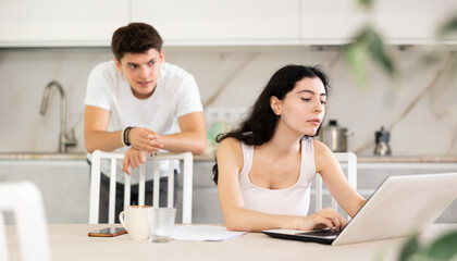 Fototapeta premium Husband swears at his wife. Family business, computer work, assistant, incorrectly written report