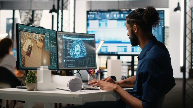 Real estate developer in a corporate office using machine learning, cognitive computing and cybernetics to analyze blueprints and property layouts. Residential and commercial investments.