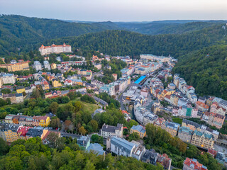Fototapeta premium Sunset panorma view of Karlovy Vary and its hotels in Czech repu