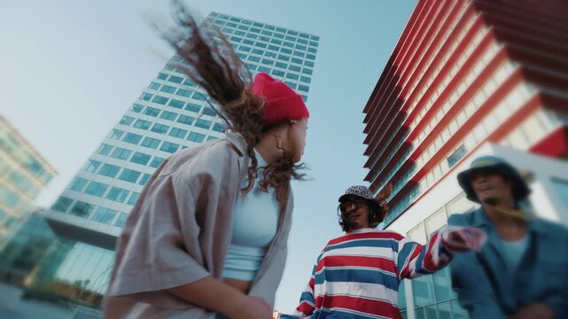 Young urban dancers perform in the city surrounded by modern skyscrapers, showcasing energy, style, and street fashion in a dynamic hip hop choreography