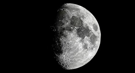 Obraz premium Close up of the moon surface revealing intricate details of craters, mountains, and valleys during a waxing gibbous phase