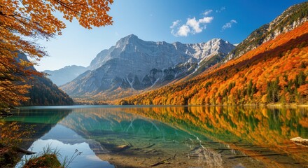 Obraz premium Scenic autumn landscape featuring a pristine lake reflecting the surrounding mountains and vibrant foliage in berchtesgaden national park