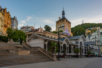 Fototapeta premium Sunset view of castle tower and market colonnade in Karlovy Vary