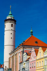 Fototapeta premium Nativity of virgin mary church at peace square in Domazlice, Cze