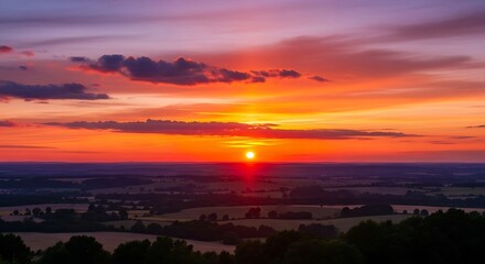 Fototapeta premium Vibrant Sunset Painting the Sky Over a Scenic Landscape.