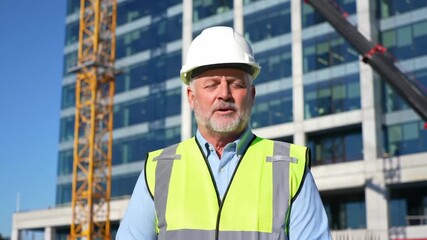 Senior foreman at construction site, crane background - Powered by Adobe