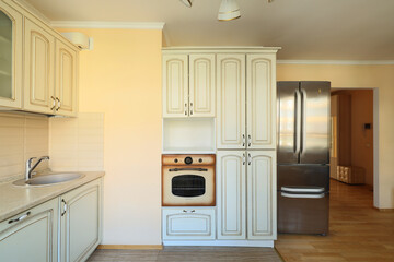 Fototapeta premium This stylish modern kitchen features classic design touches and highquality appliances