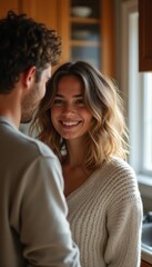 Couple sharing a joyful moment in a cozy kitchen
