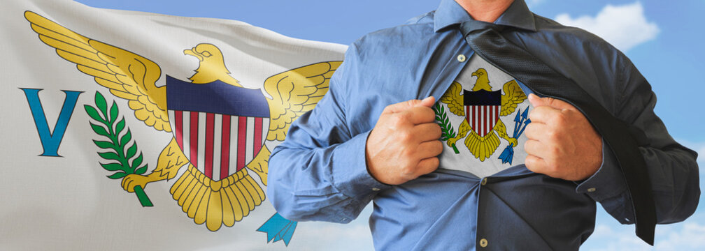 A businessman opening his shirt like super hero with United States Virgin Islands flag and shows how patriotic he is by revealing his countries flag beneath printed on a t-shirt.