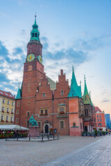 Fototapeta premium Sunrise view of town hall at Rynek, the picturesque square in ce