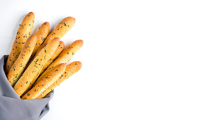 Delicious breadsticks with herbs and seeds isolated