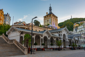 Sunset view of castle tower and market colonnade in Karlovy Vary