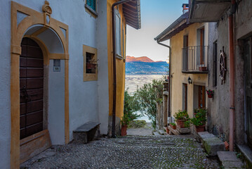 Fototapeta premium Sunset view of colourful houses at Isola dei Pescatori at Lago M