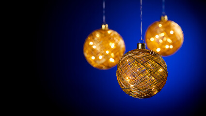 Fototapeta premium Festive Golden Christmas Ornaments Against Blue Background