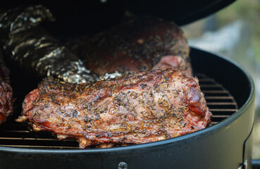 Grilled lamb with herbs on barbecue grill
