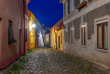 Fototapeta premium Night view of a Colourful street at Jewish quarter of Trebic, Cz
