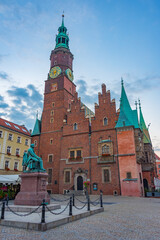 Fototapeta premium Sunrise view of town hall at Rynek, the picturesque square in ce