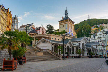 Obraz premium Sunset view of castle tower and market colonnade in Karlovy Vary