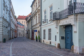 Fototapeta premium Narrow street in the historical center of Krakow, Poland