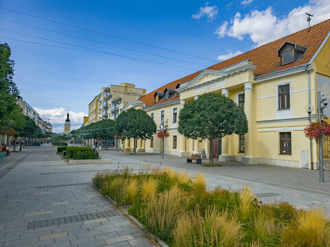 People passing through Hlavna street in Trnava, Slovakia