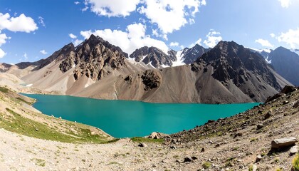 Mountain lake panorama under a partly cloudy sky