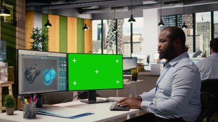 Renewable energy engineer in modern office advances wind turbine technology using green screen computer, applying new materials and designs to optimize power generation, camera A - Powered by Adobe