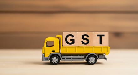 Truk kuning membawa blok GST untuk bisnis - Yellow truck carries GST blocks for business