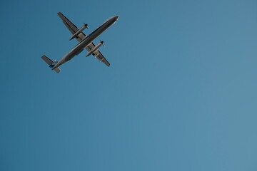 Minimalist Travel Background: A Passenger Plane with Ample Copy Space in the Sky