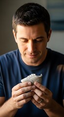 Man examines small shoe