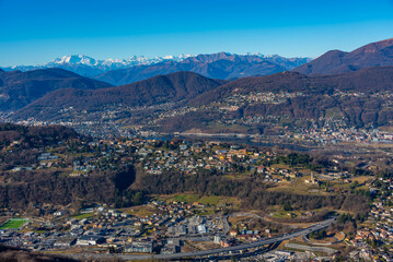 Obraz premium Panorama of Alps viewed behind Lugano from Monte San Giorgio in