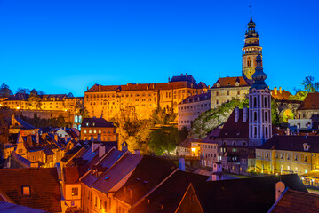Fototapeta premium Night view of Cesky Krumlov castle and Saint Jost church, Czech