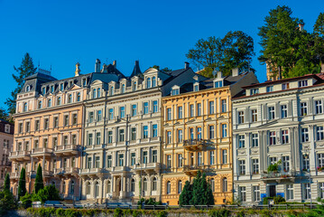 Obraz premium Sunrise view of the colourful houses at Karlovy Vary promenade,