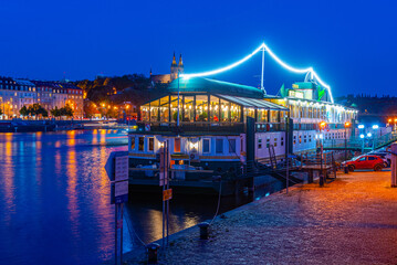 Sunset view of Smichovska naplavka riverside in Prague, Czech re