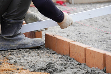 Brick Exterior Construction Work（レンガを使った外構工事の作業風景）